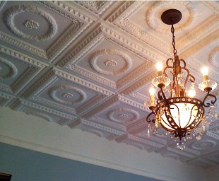 A finished ceiling with Faux Tin Glue-up Tiles